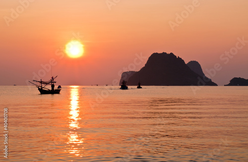 Beautiful sunrise on the beach at prachuapkhirikhan in Thailand photo