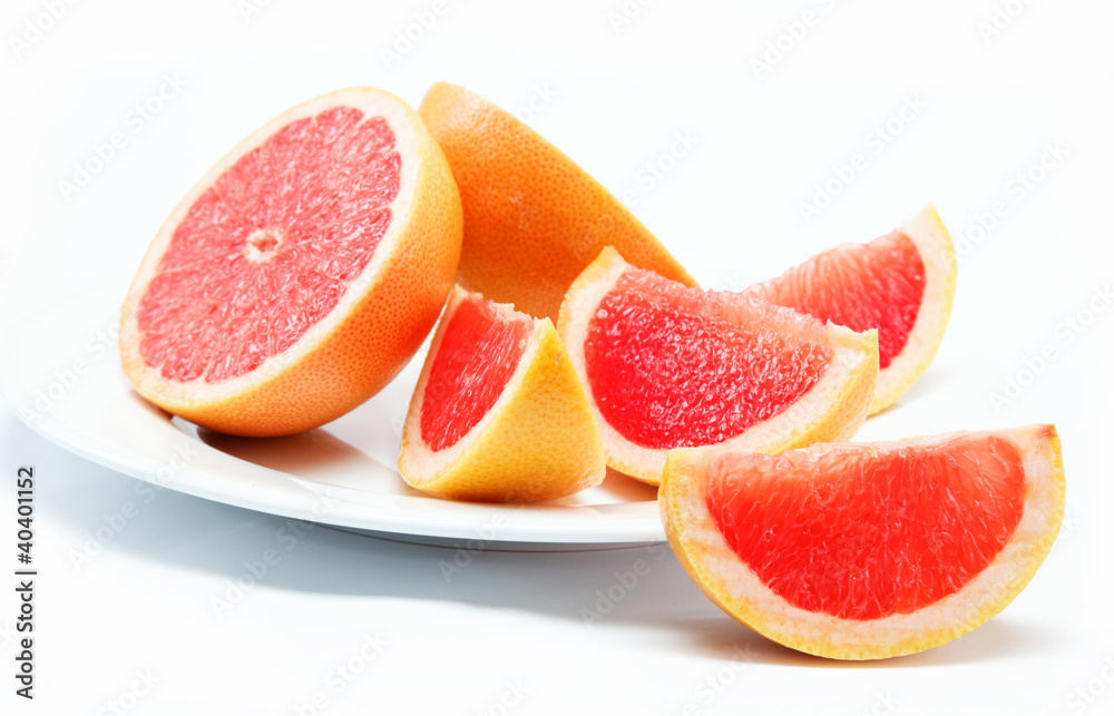 Fresh grapefruit on a white background.