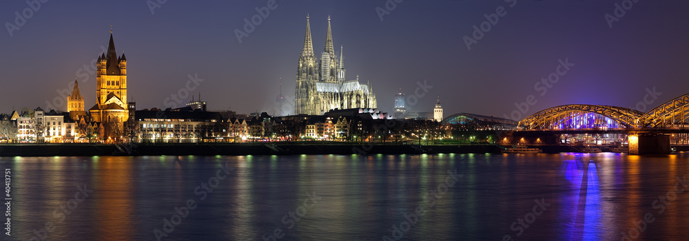Naklejka premium Evening panorama of Cologne from the Rhine river, Germany