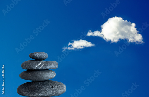 balancing zen stones and blue sky