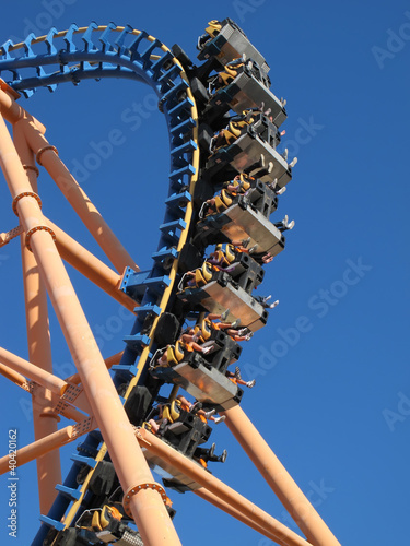 moving roller coaster with blue sky