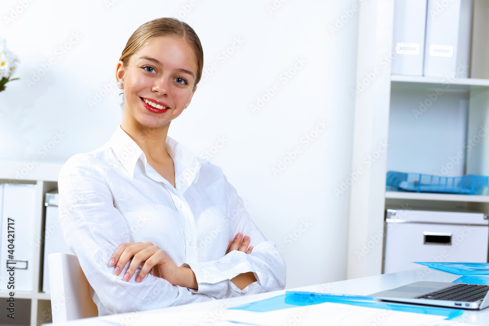 Young woman in business wear working in office Young woman in business wear working in office