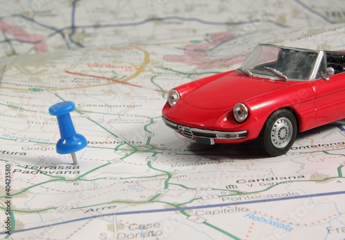 red spider car model on the road