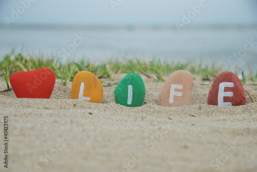 love life concept on colourful pebbles