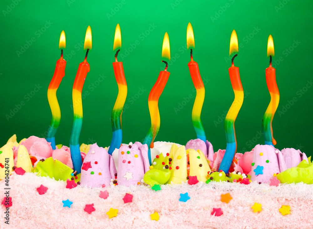 Birthday cake with candles on green background Birthday cake with candles on green background