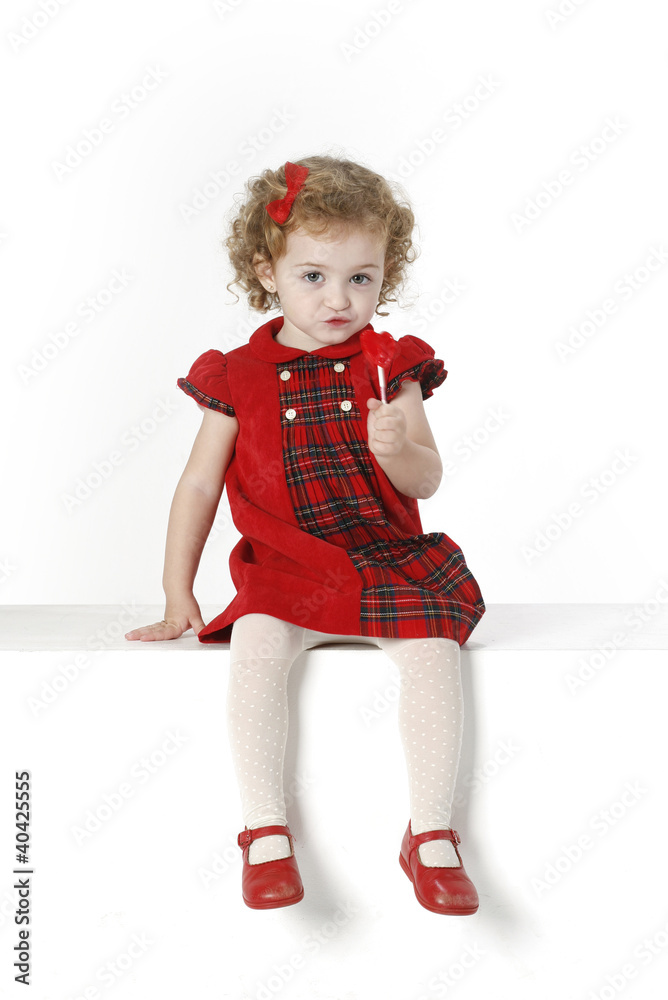 Niña con vestido rojo Stock Photo | Adobe Stock