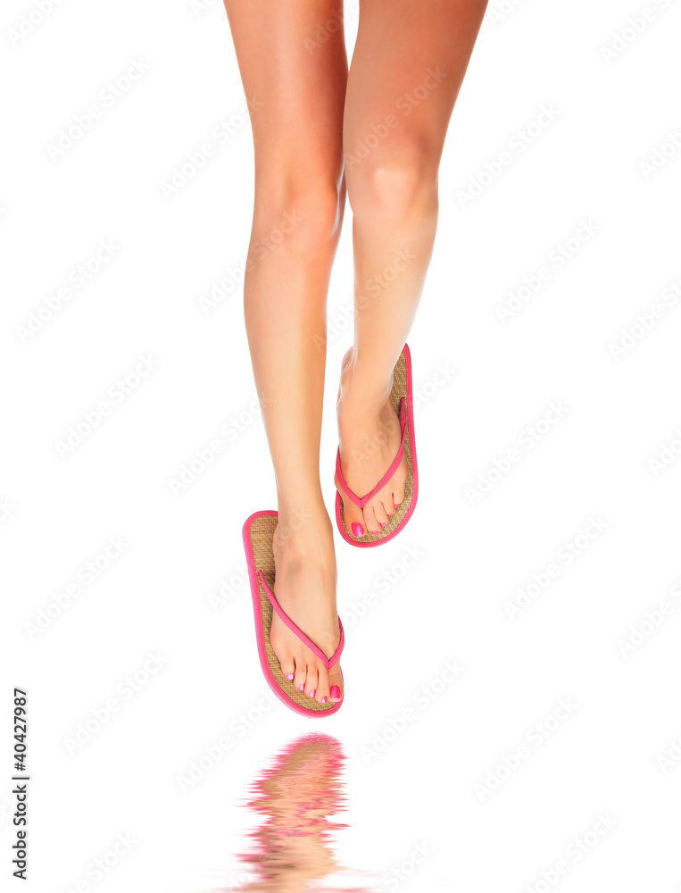 Female legs with flip-flops Female legs with flip-flops