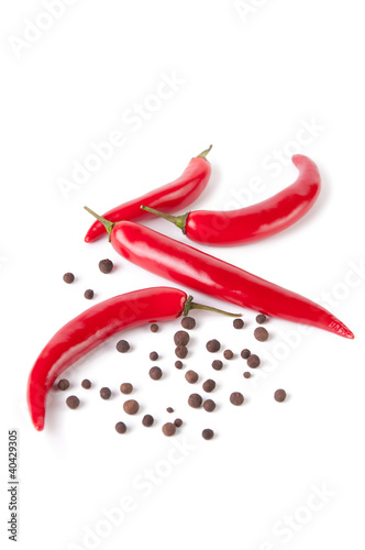 Hot chili peppers and black assorted pepper