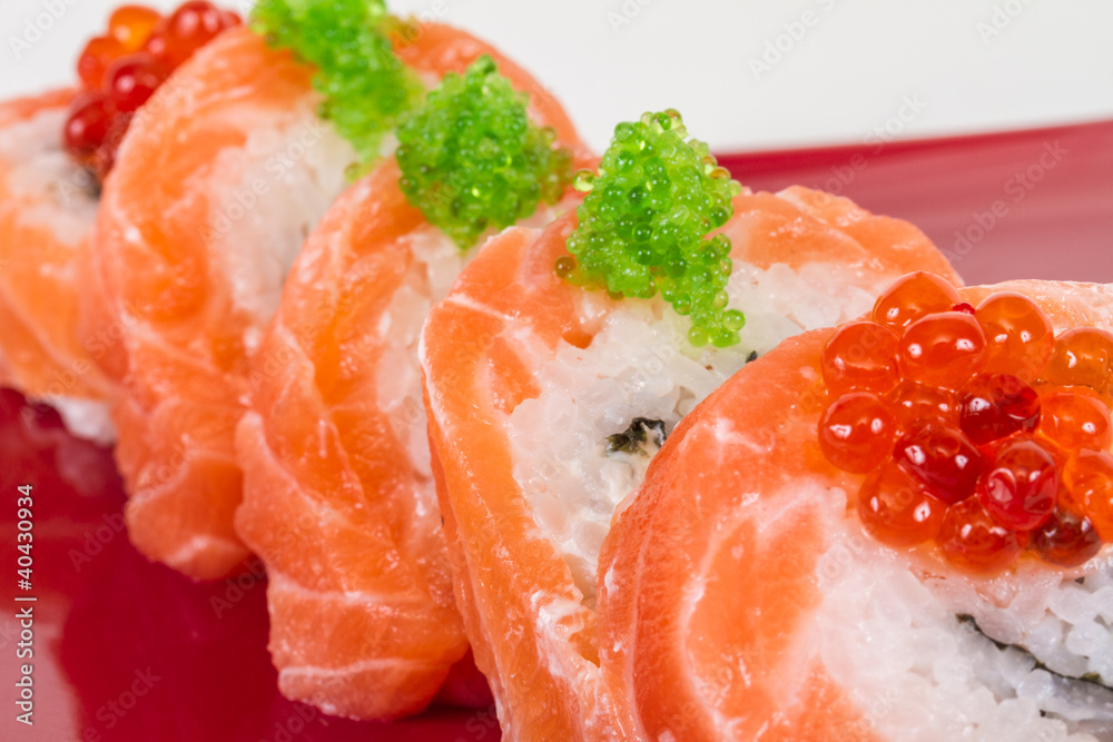Japanese sushi traditional japanese food.Roll made of salmon, re Japanese sushi traditional japanese food.Roll made of salmon, re