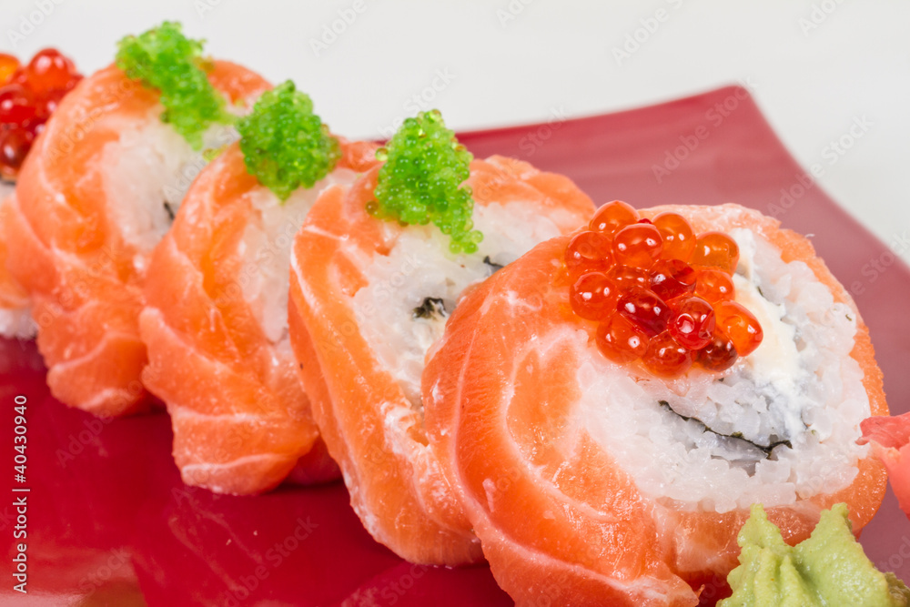 Japanese sushi traditional japanese food.Roll made of salmon, re Japanese sushi traditional japanese food.Roll made of salmon, re