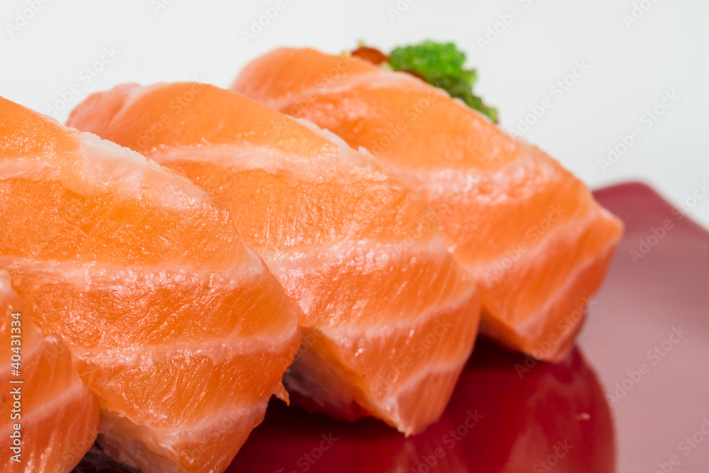 Japanese sushi traditional japanese food.Roll made of salmon, re Japanese sushi traditional japanese food.Roll made of salmon, re