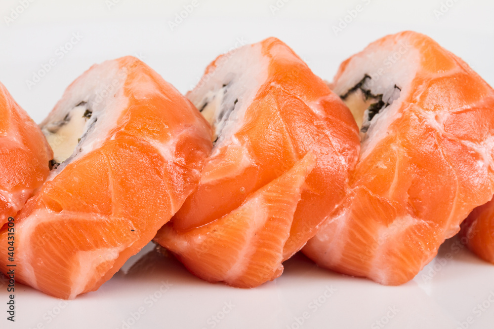 Japanese sushi traditional japanese food.Roll made of salmon, re Japanese sushi traditional japanese food.Roll made of salmon, re