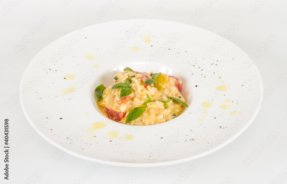 photo of delicious risotto dish with herbs and tomato on white b photo of delicious risotto dish with herbs and tomato on white b