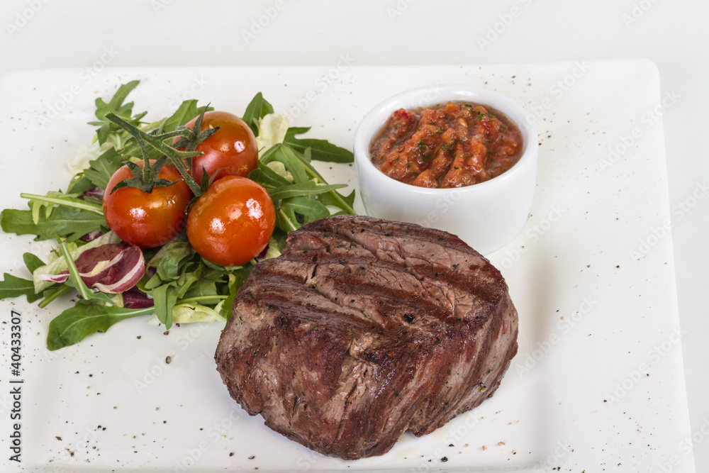 Grilled Beef Steak Isolated On a White Background Grilled Beef Steak Isolated On a White Background