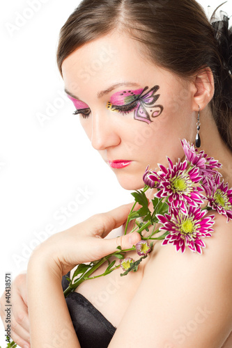 beautiful girl with bodyart and make up with flower