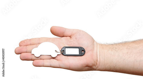 human hands holding model car with blank tag isolated on white b