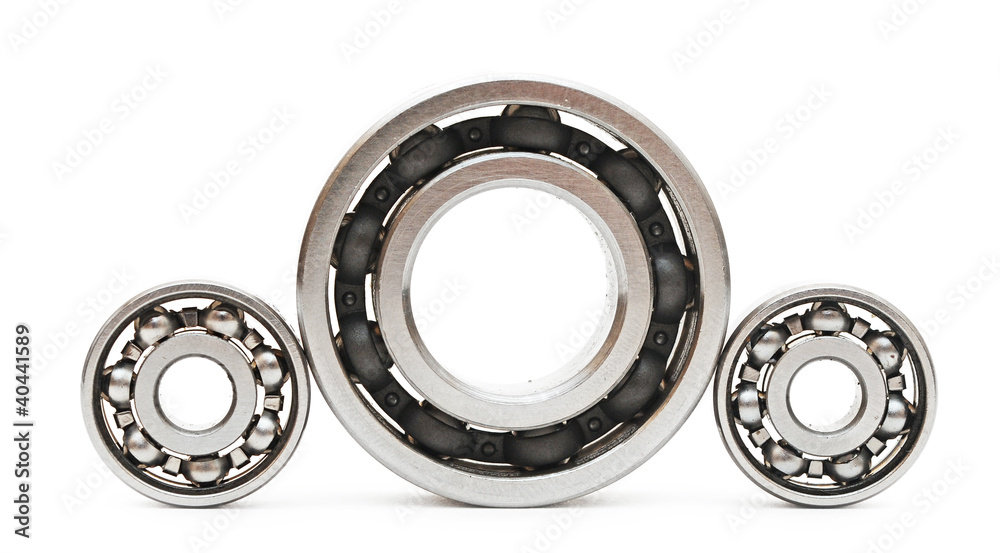 Big and small ball bearings on white background Big and small ball bearings on white background