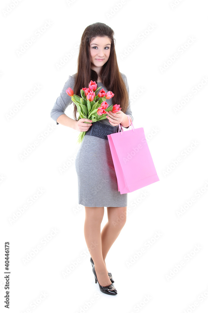 Happy girl in dress with shopping bags and flowers Happy girl in dress with shopping bags and flowers