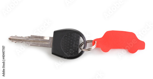 Car key with charm isolated on white