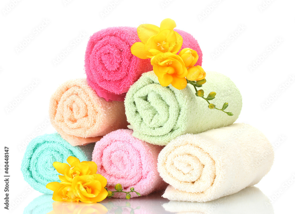 colorful towels and flowers isolated on white colorful towels and flowers isolated on white