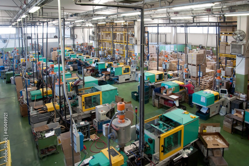 Injection molding machines in a large factory © Moreno Soppelsa