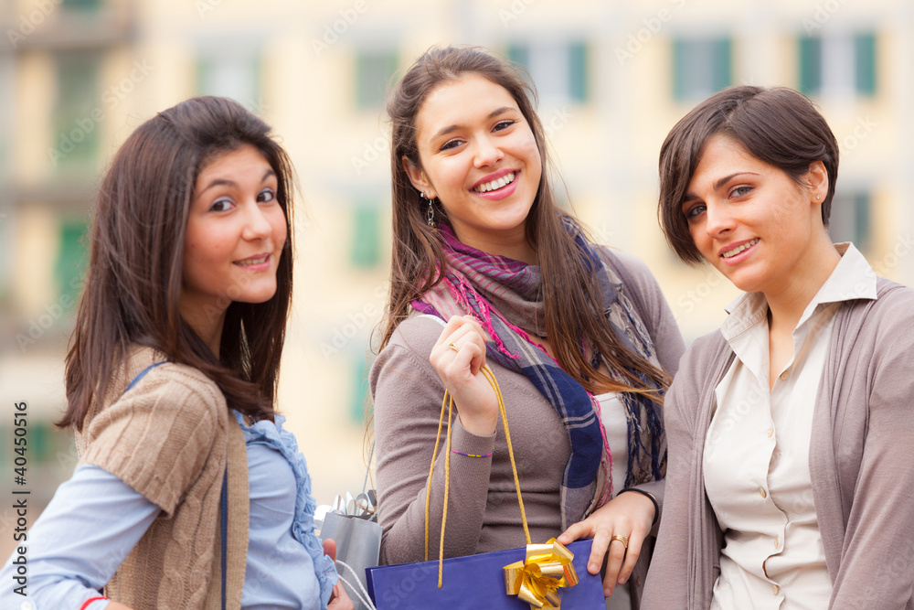 Three Beautiful Young Women with Shopping Bags Three Beautiful Young Women with Shopping Bags