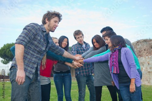 Multiracial Students with Hands on Stack