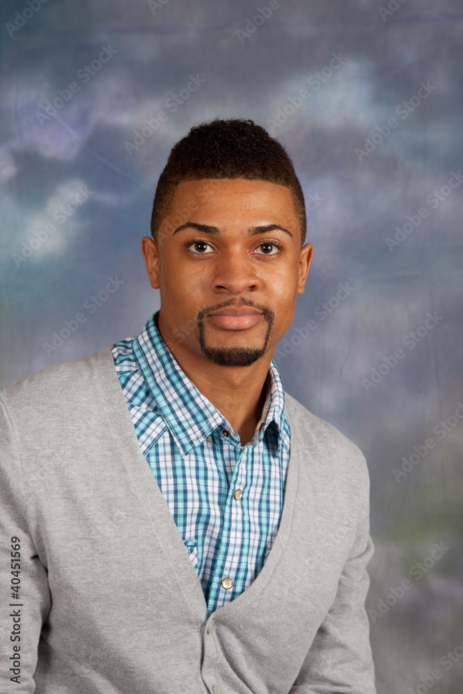 black man looking thoughtful at the camera