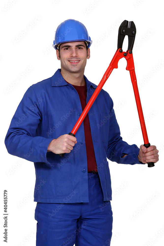 blue collar posing with giant monkey wrench blue collar posing with giant monkey wrench
