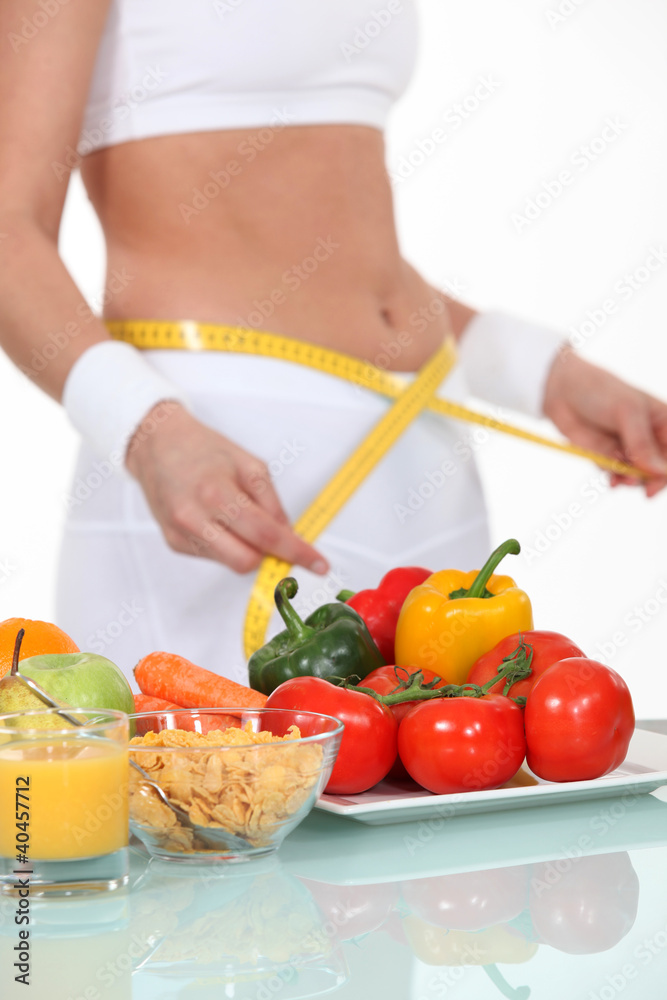 Woman measuring her waistband
