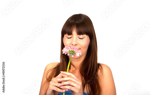 young beautiful brunette woman with a flower happy