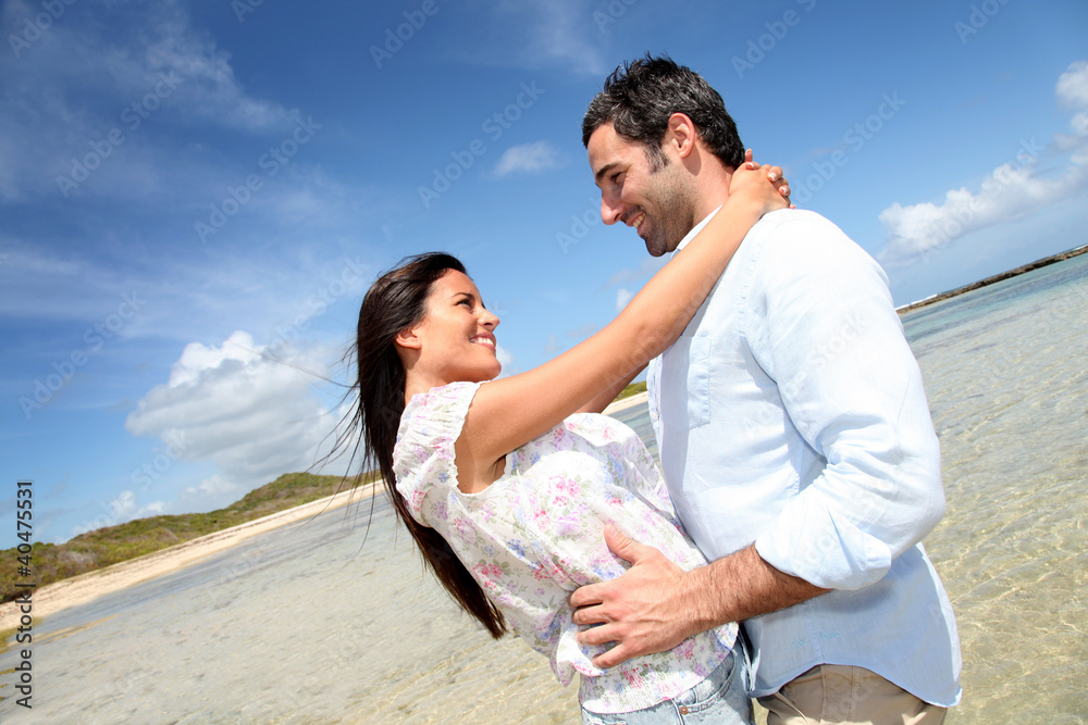 Couple of lovers embracing each other at the beach Couple of lovers embracing each other at the beach