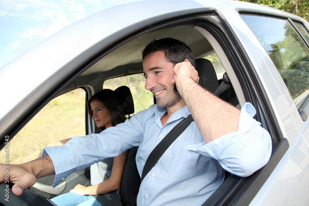 Man talking on mobilephone while driving Man talking on mobilephone while driving