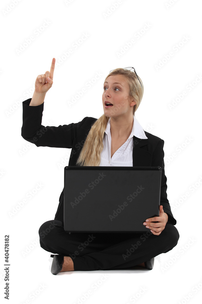 Woman with laptop having idea