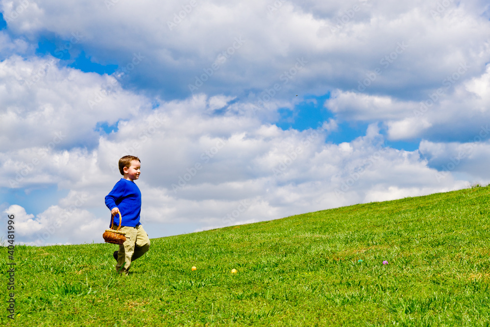 Young boy running with basket to collect Easter Eggs Young boy running with basket to collect Easter Eggs