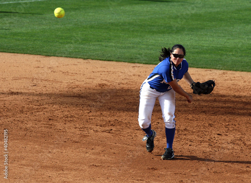 Softball Player Throwing Ball