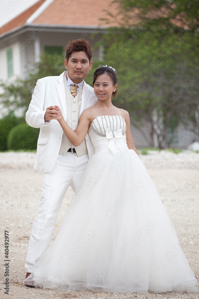 couples of man and women in wedding suit