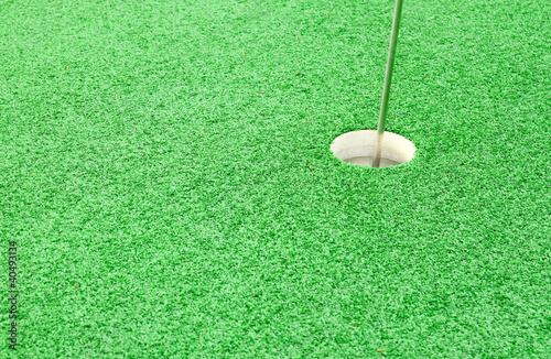 Golf hole on the green grass