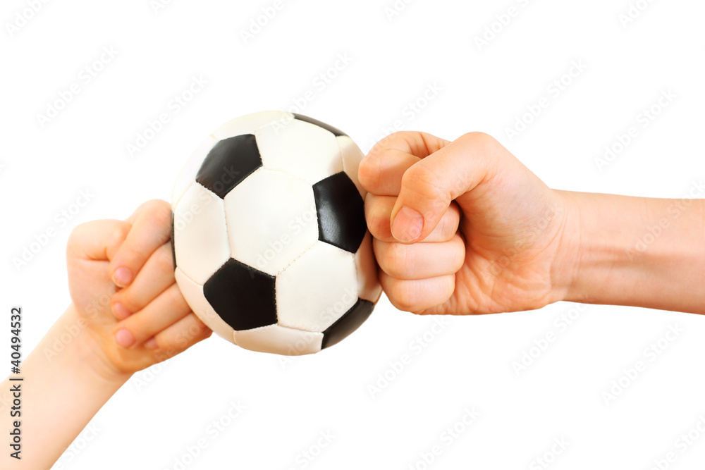 Children fists rested in little soccer ball isolated on white