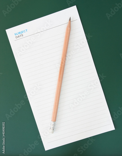 Pencil and blank notepad