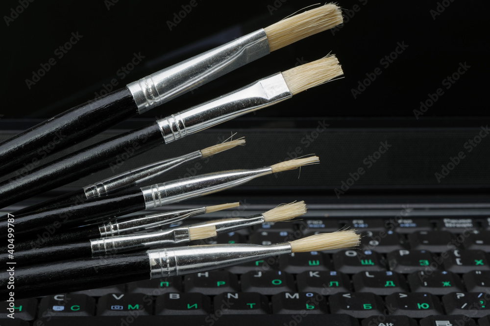 Brush and a laptop Brush and a laptop