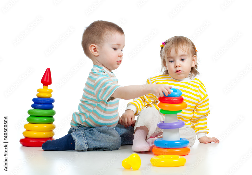 two little children playing with color toys two little children playing with color toys