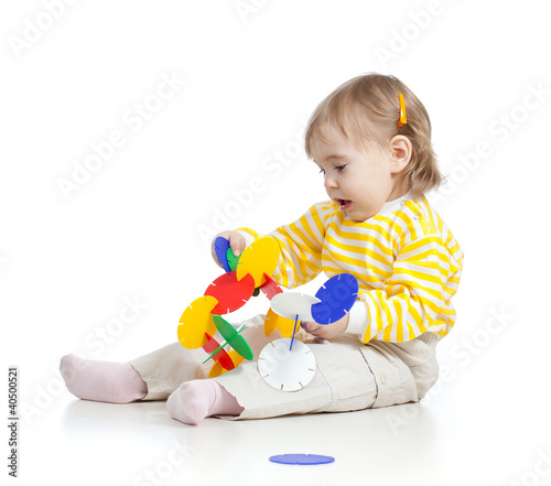 little child assembling con...