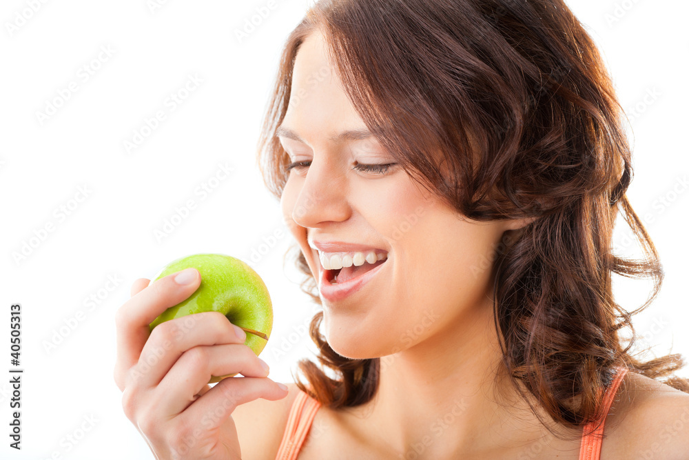 Young woman bites in a fresh and healthy apple Young woman bites in a fresh and healthy apple