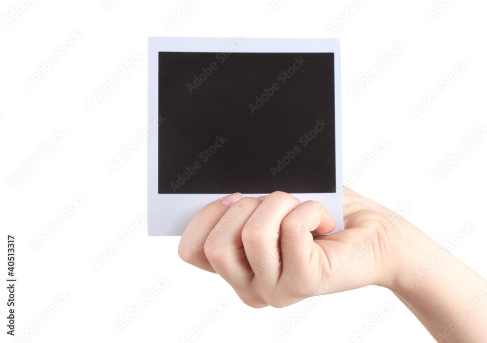 One photo paper in hand isolated on white One photo paper in hand isolated on white
