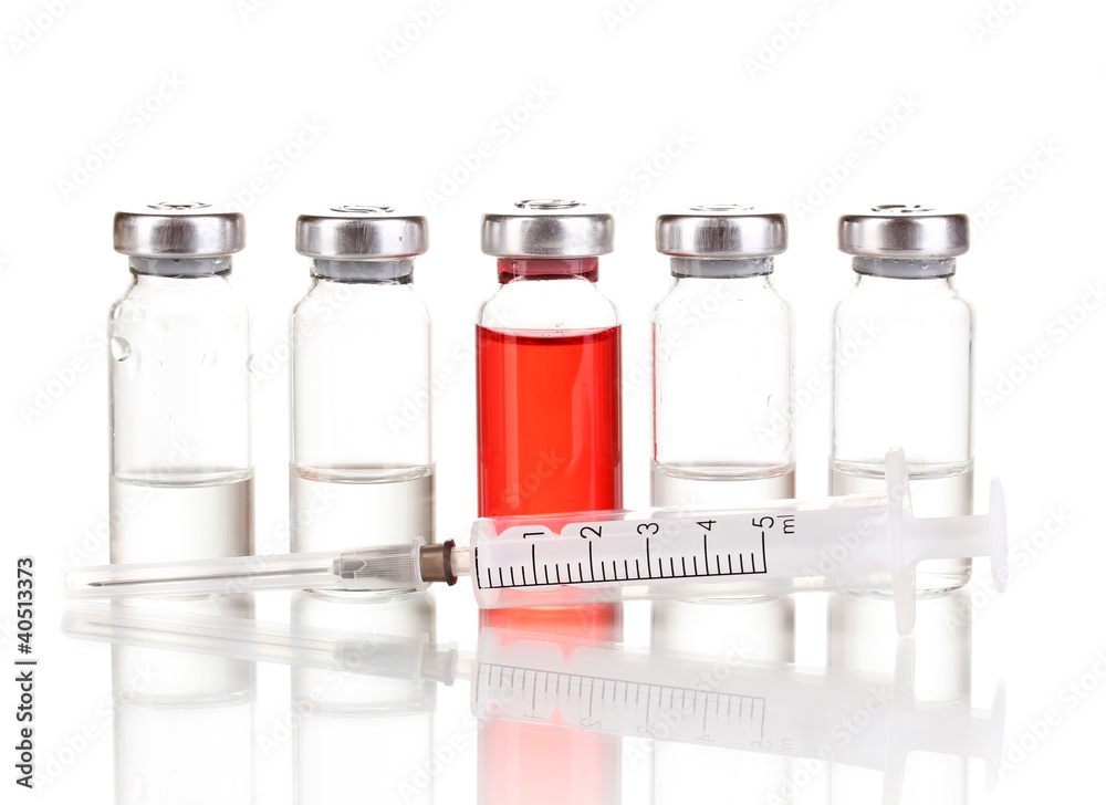 Syringe and medical ampoules isolated on white Syringe and medical ampoules isolated on white