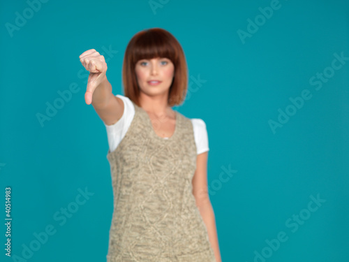 attractive woman smiling with her thumb down