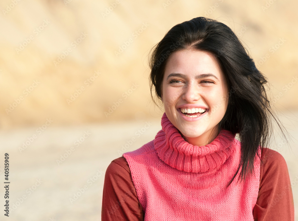 Portrait of laughing girl in pink