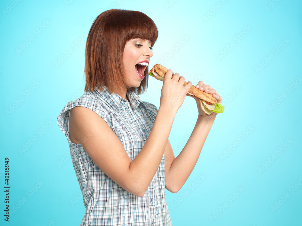 beautiful young woman eating a big sandwich beautiful young woman eating a big sandwich
