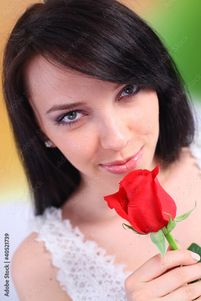 Sexy brunette holding a red rose Sexy brunette holding a red rose